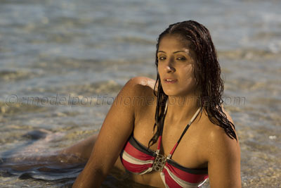 multi-colored bikini modeled by attractive curvy model